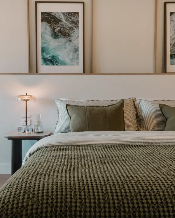 South House King Suite: the bed under framed prints
